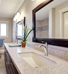 Elegant bathroom mirror reflecting a clean, bright room, offered by J&M Windows and Glass, Inc.