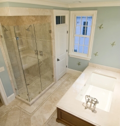 Shiny silver frames for bathroom shower doors from J&M Windows and Glass, Inc.