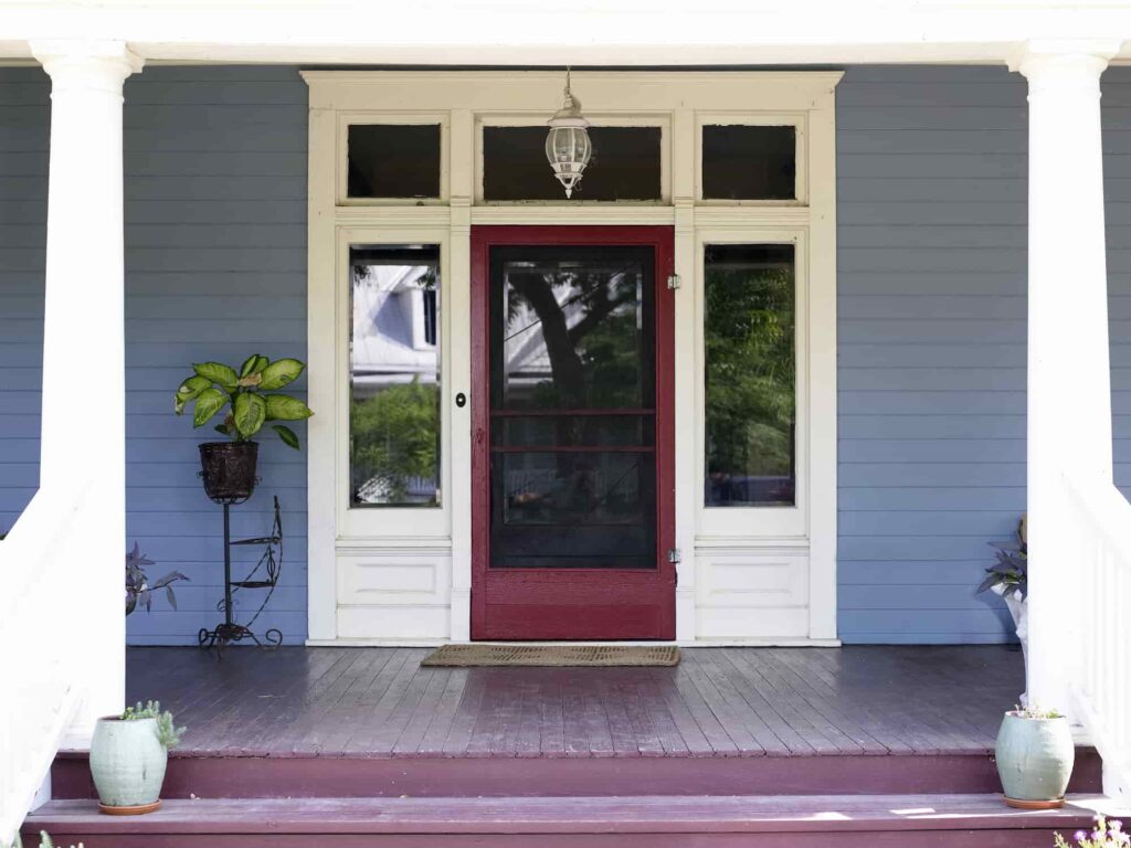 A front porch displaying a striking red door, embodying the character of San Jose homes.