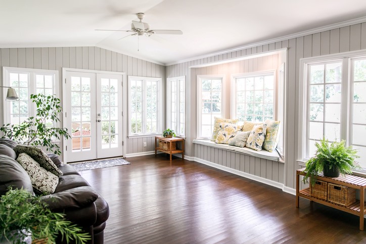 Living room with Marvin windows, indoor plants, and natural light in San Jose